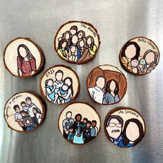 six wood slices with pictures of people painted on them