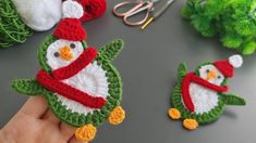 crocheted christmas ornaments are being displayed on a table with scissors and other items