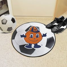 a soccer ball and shoes on the floor