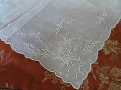 SPECIAL: Purchase 3 or more trims/hankies/collars/Doilies/postcards or buttons and shipping is FREE ! Shipping will be refunded. Beautiful vintage 1920s Bridal  hanky with  dainty hand embroidery featuring hand embroidered raised flowers, and exceptional handwork including seed embroidery.  The  lovely handkerchief measures 10.25 inches by 11 inches.  The condition is wonderful, could use a quick laundering from storage if desired.  Great for display among your boudoir collection, perfect to gif Hand Embroidery Clothes, White Work Embroidery, Vintage Handkerchiefs With Embroidered Border As Gift, Vintage Embroidered Wedding Handkerchiefs, Bridal Handkerchief, Vintage White Handkerchiefs With Lace Trim, Embroidered Handkerchief Vintage, Vintage Cream Handkerchiefs With Lace Trim, Lace Handkerchief