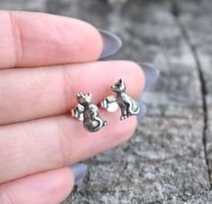 "Black Cat 3d Earring Studs: -.925 solid sterling silver. -Matching Sterling butterfly backs. -Cats measure 11mm x 7mm More Stud Earrings here: https://www.etsy.com/shop/AWildViolet?ref=seller-platform-mcnav&section_id=13960732 💜Check out our new \"Ready to Ship\" section for gifts that ship in 1 business day.  https://www.etsy.com/shop/AWildViolet?ref=seller-platform-mcnav§ion_id=23587515 Connect with us on Instagram @a_wild_violet for sales and giveaways! **All items are in stock and ship wit 3d Earrings, Black Cat Earrings, Cat 3d, Cat Earrings Studs, Cat Post, Sterling Silver Cat, Silver Cat, Earring Studs, Cat Jewelry