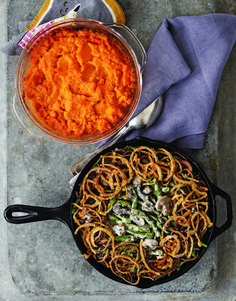 two pans filled with food sitting on top of a table