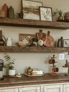 the shelves are filled with different types of kitchen utensils and other things on top of them