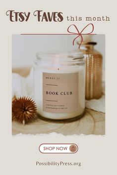 a candle with the words book club on it and an image of a flower next to it