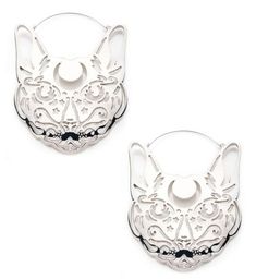 two silver earrings with an animal face on them