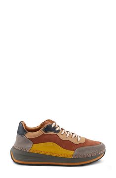 This sporty sneaker is topped with colorblocked leather and grounded on an exaggerated sole. 1 1/2" heel; 1" platform Lace-up style Removable, cushioned insole with arch support Leather upper and lining/synthetic sole Made in Turkey Leather Chunky Sneakers With Rubber Sole For Sports, Brown Platform Sneakers With Contrast Sole And Round Toe, Brown Low-top Platform Sneakers In Synthetic, Brown Sneakers With Contrast Sole For Walking, Brown Sporty High-top Sneakers For Walking, Modern Leather Sneakers With Boost Midsole, Orange Low-top Sneakers For Walking, Sporty Brown High-top Sneakers For Walking, Modern Brown Sneakers With Cushioned Footbed