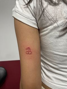 a woman with a small tattoo on her arm