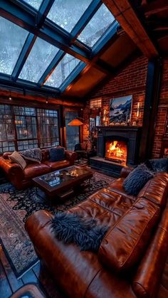 a living room filled with furniture and a fire place in the middle of it's walls