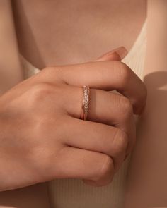 a woman's hand with a ring on it