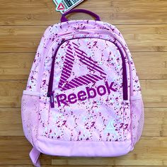 Reebok Marley Compact Size Backpack Water Resistant Padded Back Hydration Pocket Valuables Pocket Device Storage Adjustable Strap Approx Dimension: 16.5”H X 11.5”W X 5.5”D Pink Sporty Gym Backpack, Sporty Pink Gym Backpack, Dr Seuss Shirts, Small Duffle Bag, Do Not Conform, Device Storage, Light Backpack, Purple Orchids, Reebok Women