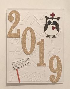 a new year card with an owl on it and the number nineteen in gold glitter