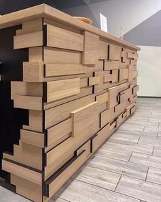 a large wooden cabinet sitting on top of a tiled floor