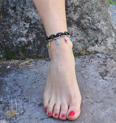 This listing is for one anklet. Beautiful macrame anklet. You can wear it alone or in combination with the barefoot sandals available in my shop (picture 1, 3 and 6) https://www.etsy.com/listing/218100733 This anklet is made with waxed polyester cord, tibetan silver beads, tibetan silver leaf charms and achira seed beads. They close with a lobster claw and on the other side a small chain allows to adjust the length of the anklet. The anklet comes in a beautiful silk pouch. This anklet is made to Black Hippie Bracelets For Festival, Hippie Black Bracelets For Festivals, Traditional Black Bracelets For Beach, Adjustable Black Bohemian Barefoot Sandals, Black Ankle Strap Barefoot Sandals For Festival, Black Bohemian Barefoot Sandals For Beach, Handmade Ankle Wrap Bracelets For Festival, Black Beaded Anklets For Festival, Handmade Adjustable Black Anklet