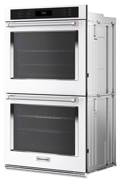 two ovens side by side with the doors open