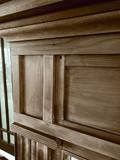 an old wooden cabinet with glass doors