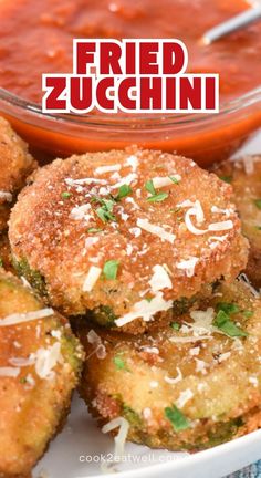 fried zucchini with tomato sauce and parmesan cheese on the top, in a white bowl