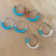 'Maddie' Beaded Hoops, Sterling Silver Hoop Earrings, Gold Tone Hoop Earrings, Southwest, Turquoise, Orange, Sustainable Three pairs to choose from. Each is one-of-a-kind. I love the Southwest vibes of these colors; especially the blue, orange, and bronze pair at the top of the first photo. Choose 'Blue and Orange' for that pair. Blue: Shown on the left of the first photo and alone in the second, third, and fourth photos. One inch sterling silver hoops with nine matte metallic turquoise glass se Adjustable Hoop Jewelry With Dangling Beads, Blue Beaded Small Hoop Jewelry, Blue Hoop Jewelry For The Beach, Blue Beaded Hoop Earrings For The Beach, Adjustable Small Hoop Jewelry With Dangling Beads, Small Hoop Beaded Jewelry For Beach, Beach Jewelry Small Hoop With Colorful Beads, Blue Small Hoop Jewelry For The Beach, Blue Small Hoop Jewelry For Beach