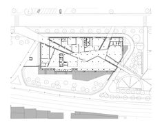 an architectural drawing shows the ground plan for a building with multiple floors and two levels