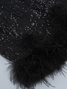 Color: Black Material: Polyester Feathers & sequins details Delicate dry clean Protect accessory before washing Cool iron Sample size S Our Style No. ZC_NIKA_B Black Glamorous Sequin Fabric For Formal Events, Black Glamorous Sequin Fabric For Formal Occasions, Glamorous Black Sequin Fabric For Formal Occasions, Black Sequin Dress For Winter Party, Black Winter Dress With Contrast Sequin, Black Sequin Evening Dress For Winter, Black Embellished Sequin Fabric For Formal Occasions, Sequin Outfit, Belted Blazer