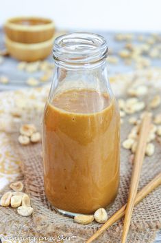 a jar filled with peanut butter sitting on top of a table