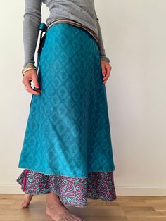 "This is super easy to wear a must have summer long skirt  made double sided, has two layers both in blue colour stylish flared hem line  Nice looking and comfy outfit for everyday and ocassions will fit all ladies sizes 8-14  MEAESURE free size  length 38\" | 100cm MATERIAL * upcycled silk  For more boho style ideas please visit also  https://www.etsy.com/uk/shop/Gyaki CARE INSTRUCTIONS  * Wash in warm water * Hand wash recommended * Hang to dry  IMPORTANT NOTE  * Please note that colour shown Ankle-length Relaxed Lined Skirt, Ankle-length Relaxed Maxi Skirt With Lining, Bohemian Silk Wrap Skirt For Summer, Silk Tiered Maxi Skirt, Traditional Silk Skirt For Summer, Silk Wrap Skirt With Relaxed Fit, Silk Long Wrap Skirt With Relaxed Fit, Silk Long Wrap Skirt With Lining, Long Silk Wrap Skirt With Lining