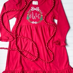 This embroidered frame featuring bows, Christmas trees, and an initial or monogram is perfect on a red dress for all the special Christmas occasions. I use embroidery thread on high quality blank dresses. To prolong the life of your appliqué, please wash inside out and lay flat to dry. Due to the personal nature of this design I do not accept returns. If you are unsatisfied in any way please reach out! Follow me on Instagram @olivia_tate_applique for new products and special preorder deals. Winter Embroidered Red Dresses, Red Embroidered Winter Dress, Embroidered Holiday Dresses For Festive Occasions, Red Embroidered Christmas Dress, Embroidered Dresses For Festive Holiday, Red Embroidered Dress For Christmas, Holiday Red Embroidered Dress, Christmas Dress Green, Green Christmas Dress