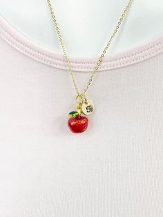 This is a gold -tone red apple fruit charm with hand stamped initial charm on brass/stainless steel 18 inches chain. ♥ You will receive 1 necklace. HOW TO ORDER 1) Select the quantity 2) Select the initial  3) Add to cart DESCRIPTION ♥ Necklace, Gold Plated over Stainless steel Cable Chain with Lobster Claw Clasp, Size: about 17.7 inches (45cm) long, 1-2mm wide, Nickel Safe, ♥ Initial Charms, Gold Plated over Stainless steel, Size: about 8-10mm in diameter, 1mm thick, Nickel Safe, ♥ Red Apple Ch Apple Necklace, Enamel Pendants, Fruit Necklace, Disney Themed Outfits, Apple Fruit, Stainless Steel Cable, Themed Outfits, Initial Charm, Red Apple