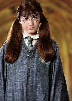 a woman with long hair wearing glasses and a harry potter costume