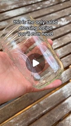 a person holding a glass jar with something in it