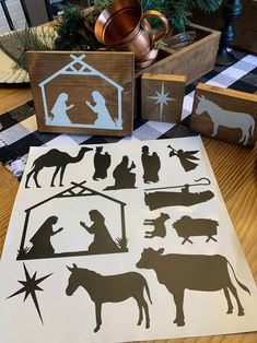 the nativity scene stencils are displayed on a table with other christmas decorations