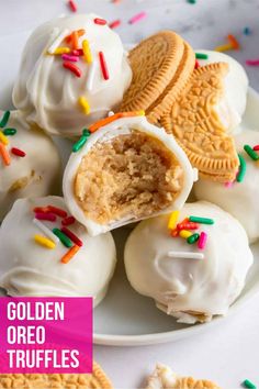 golden oreo truffles on a plate with sprinkles and white frosting