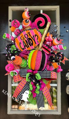 the front door is decorated with halloween decorations