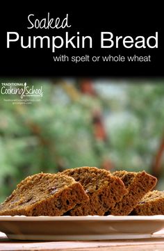 baked pumpkin bread with spelt or whole wheat on a white plate sitting on a wooden table