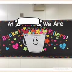 a bulletin board with an image of a bucket filled with confetti on it