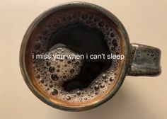 a close up of a coffee cup with the words i miss you when i can't sleep