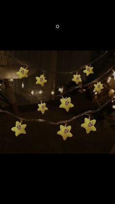 some yellow stars are hanging on a string