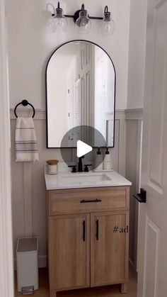 a bathroom with a sink and mirror in it