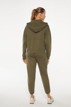 Find your Zen with this three-piece set in peaceful pine green – a textured zip-up hoodie with kangaroo pockets, a scoopneck long sleeve in rib knit, and relaxed-fit jacquard joggers featuring a quilted look. Hooded Fall Activewear For Lounging, Winter Tracksuit With Ribbed Waistband For Loungewear, Green Winter Tracksuit For Loungewear, Winter Green Activewear With Ribbed Cuffs, Casual Green Winter Activewear, Green Hooded Tracksuit For Loungewear, Casual Tracksuit With Ribbed Waistband For Fall, Green Tracksuit With Pockets For Loungewear, Green Long Sleeve Tracksuit For Loungewear