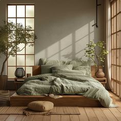 a bed sitting in a bedroom next to a window with a potted plant on top of it