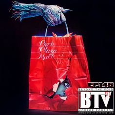 a red shopping bag with an image of a bird on it and the words dark horse mark