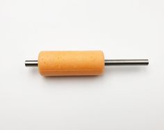 an orange piece of electrical equipment on a white surface