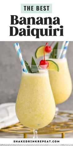 two glasses filled with banana daiquita on top of a table