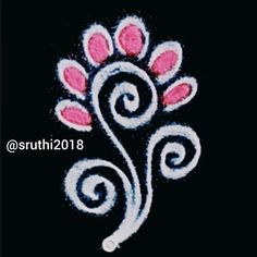 an embroidered design with pink flowers on black background