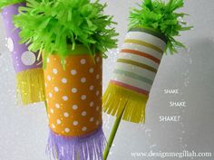 two colorful vases with green plants in them on a white tablecloth and the words shake shake shake