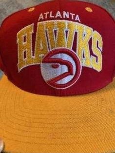 Atlanta Hawks Mitchell & Ness NBA Adjustable Fit Cap Hat Adjustable Throwback Hat For Baseball Season, Throwback Adjustable Trucker Baseball Cap, Retro Adjustable Fitted Hat For Sports, Retro Adjustable Snapback Hat For Fan Gear, Adjustable Retro Snapback Hat For Fan Gear, Retro Adjustable Baseball Cap For Fans, Adjustable Retro Baseball Cap For Fans, Adjustable Retro Sports Hat, Retro Adjustable Sports Fitted Hat