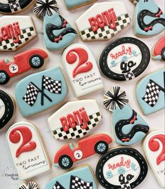 decorated cookies with race cars and numbers on them