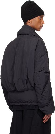 RDS-certified down-filled and lightweight nylon taffeta jacket. Water-repellent. · Shawl collar · Magnetic fastening at double-breasted press-stud closure · Welt pockets · Drawstring at hem · Dropped shoulders · Elasticized cuffs · Welt pocket at interior · Full recycled polyester sateen lining Supplier color: Black cloud Fill: 90% white duck down, 10% feather. Hooded Puffer Jacket With Padded Collar For Workwear, Winter Windbreaker With Padded Collar, Winter Workwear Windbreaker With Padded Collar, Nylon Outerwear With Padded Collar For Cold Weather, Cold Weather Nylon Outerwear With Padded Collar, Nylon Outerwear With Padded Collar For Streetwear, Streetwear Nylon Outerwear With Padded Collar, Black Winter Outerwear With Elastic Cuffs, Black Nylon Outerwear With Elastic Cuffs