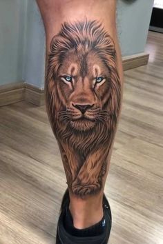 a man's leg with a lion tattoo on it and the words, i am not