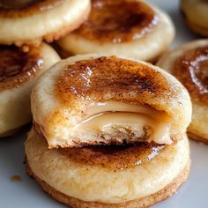 some sugary donuts with icing on them are sitting on a white plate