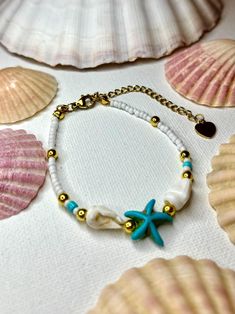 Beautiful boho blue beaded starfish bracelet 🐚 Perfect for a beachy look! Handmade in Scotland 🤍 Bohemian Starfish Jewelry For Vacation, Ocean-inspired Star Charm Jewelry For Beach, Ocean-inspired Beach Jewelry With Star Charm, Starfish-shaped Beaded Beach Jewelry, Handmade Bohemian Starfish Jewelry, Bohemian White Starfish Jewelry, Bohemian Style Bracelet With Starfish Charm, Bohemian Jewelry With Starfish Charm For Festivals, Bohemian Beaded Friendship Bracelets For Beach Season